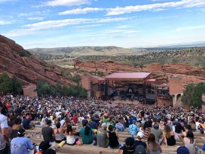 A large crowd attending Reggae on the Rocks at Red Rocks Amphitheater in Colorado