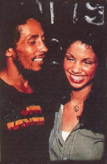 Bob Marley and girlfriend Janey Hunt smiling in a photo together