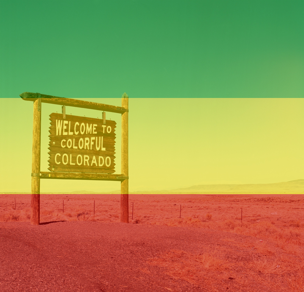 Welcome to Colorado sign with rasta colors